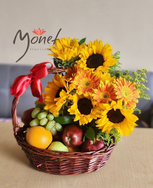Canasta mediana con frutas y girasoles