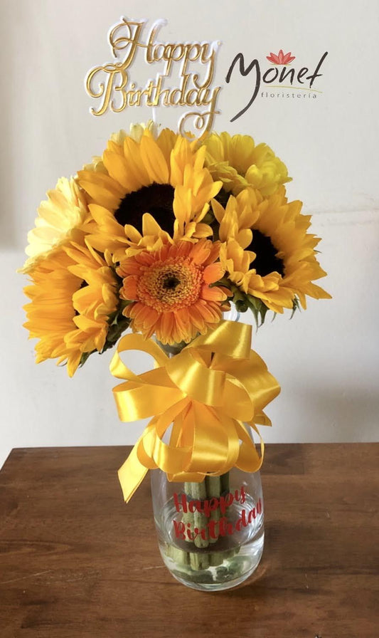 Girasoles y gerberas en vidrio